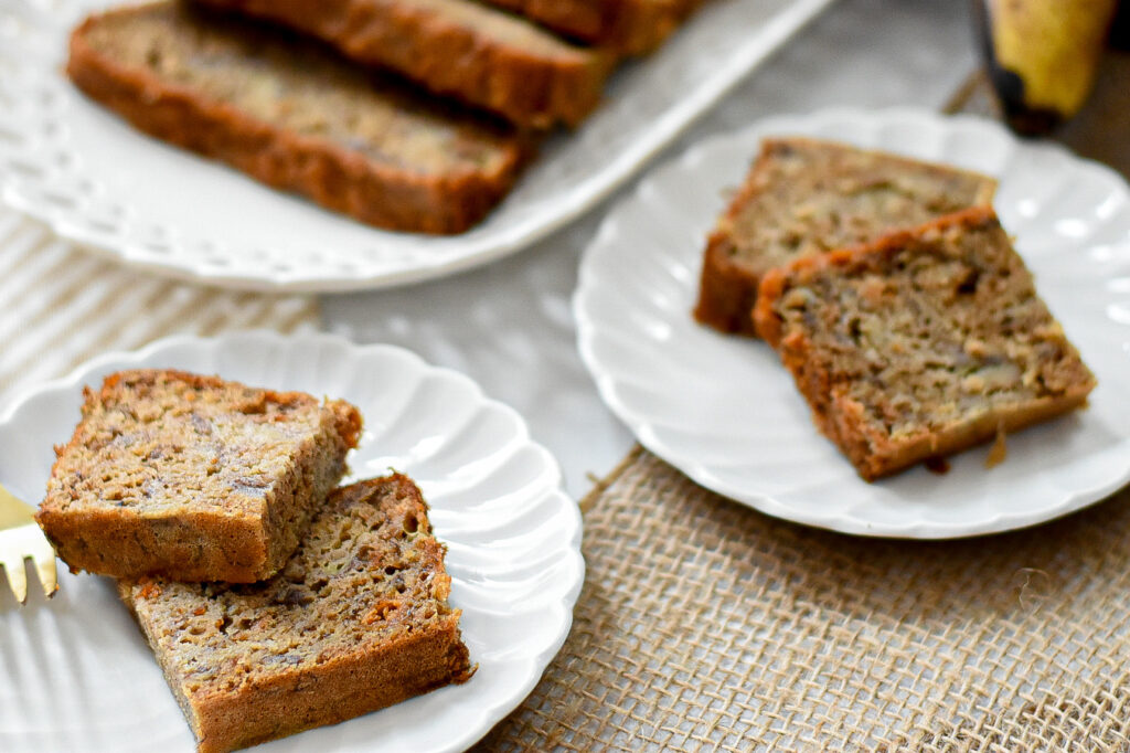 moist low sugar banana bread on a small plate