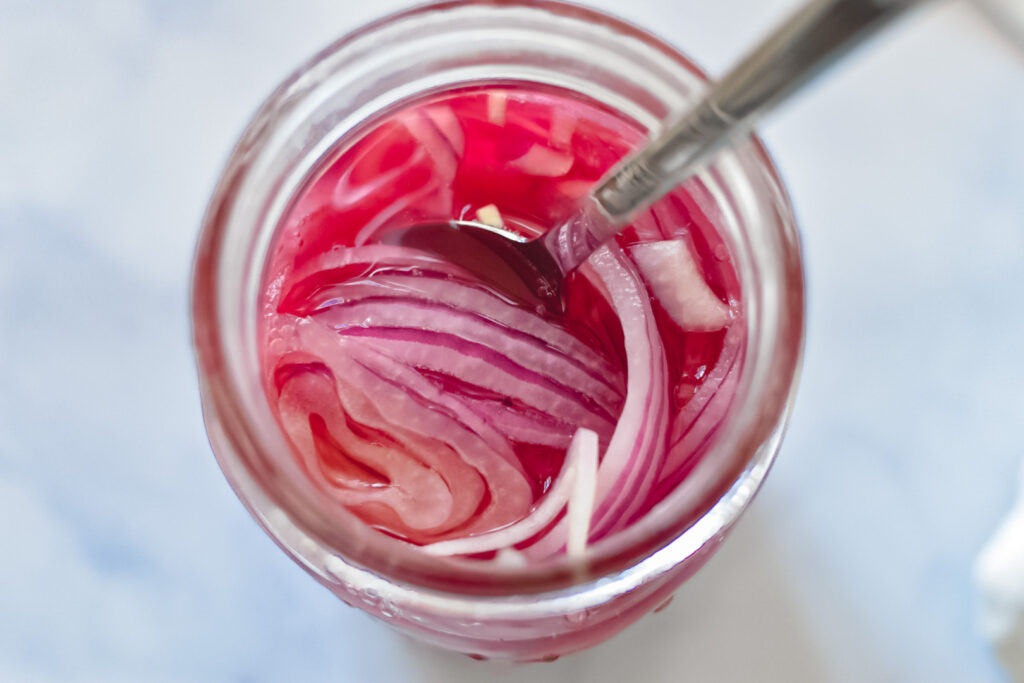 Quick pickled red onions in jar