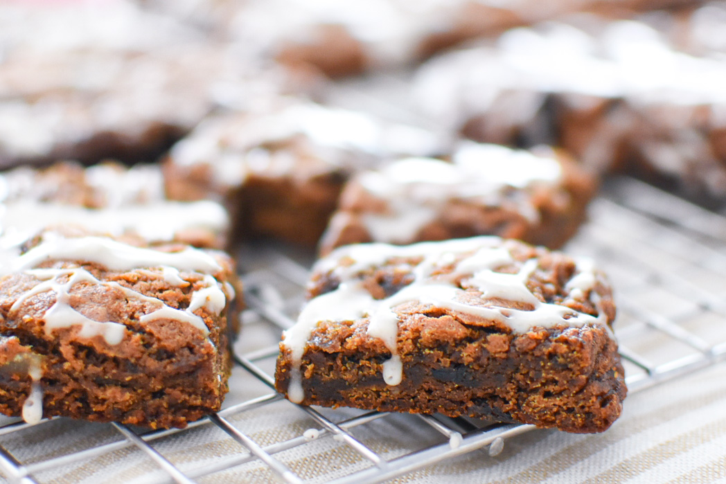 Spiced hermit bar cookies on a rack