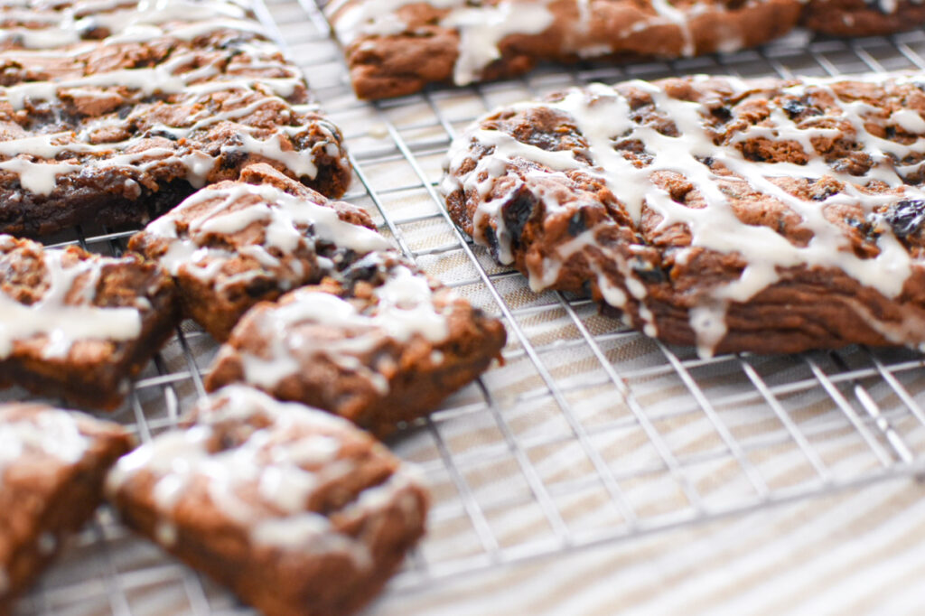 soft and chewy spiced hermit bar cookies on a cooling rack