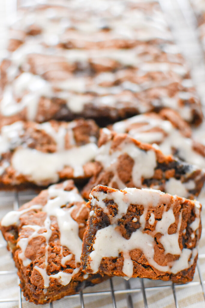 soft and chewy spiced hermit bar cookies on a cooling rack