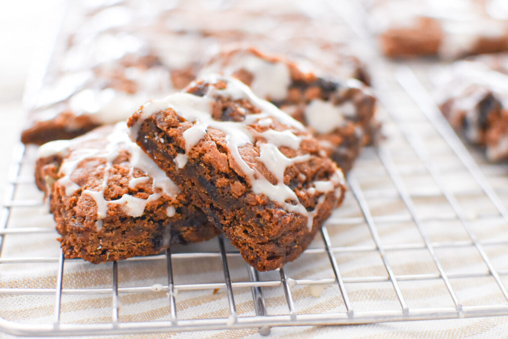 soft and chewy spiced hermit bar cookies on a cooling rack