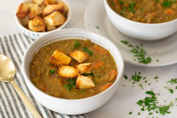 split pea and ham soup in a bowl with croutons