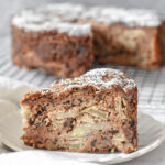 Tender and moist apple spice snacking cake on a cooling rack, slice of tender apple spice cake