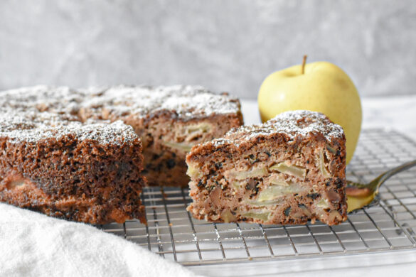 Tender and moist apple spice snacking cake on a cooling rack, slice of tender apple spice cake