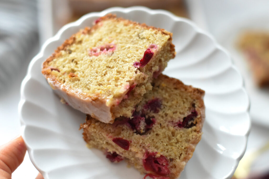 slice of cranberry bread with citrus glaze